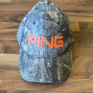 Ping Camouflage Cap with Vibrant Orange Logo